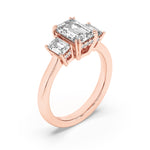 3CTW Emerald Shaped Lab Grown Diamond (F/VS) Three Stone Accented Ring in 14K Gold